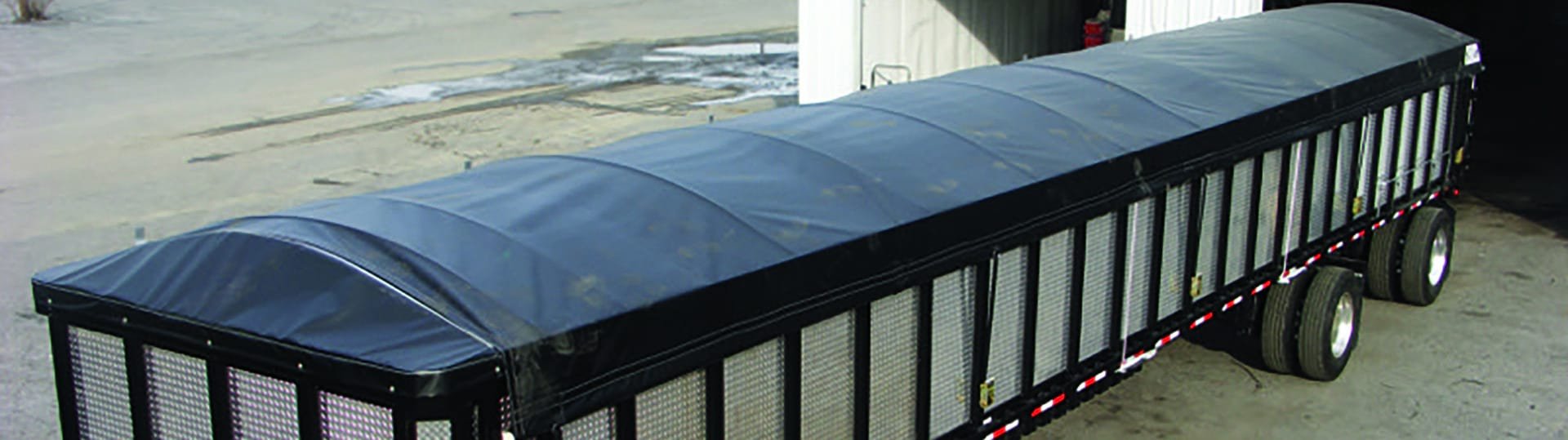 mountain tarp side roll tarp system on roll off truck